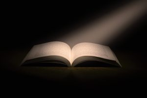 open book with light on the pages