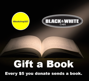 Open book with light shining on it, text says "Gift a Book"