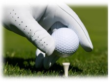Close up picture of someone putting a golf ball onto a tee